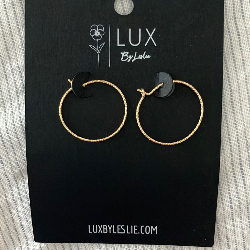 Dainty gold hoops. Never worn.